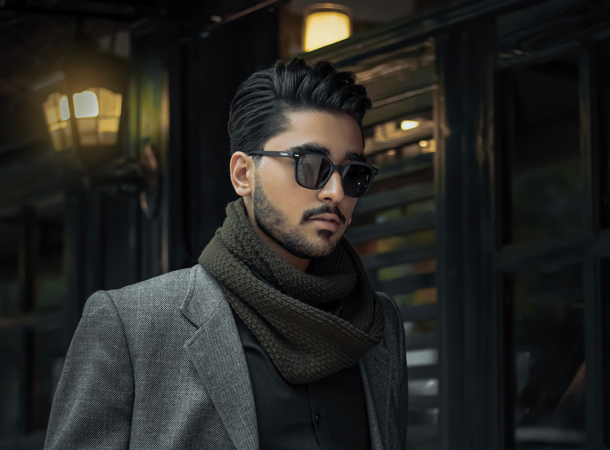 A billionaire who became a Beyorch Accredited Investor wearing grey, black and green.