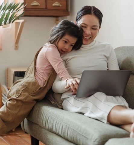A mother is showing her daughter her investment and APY