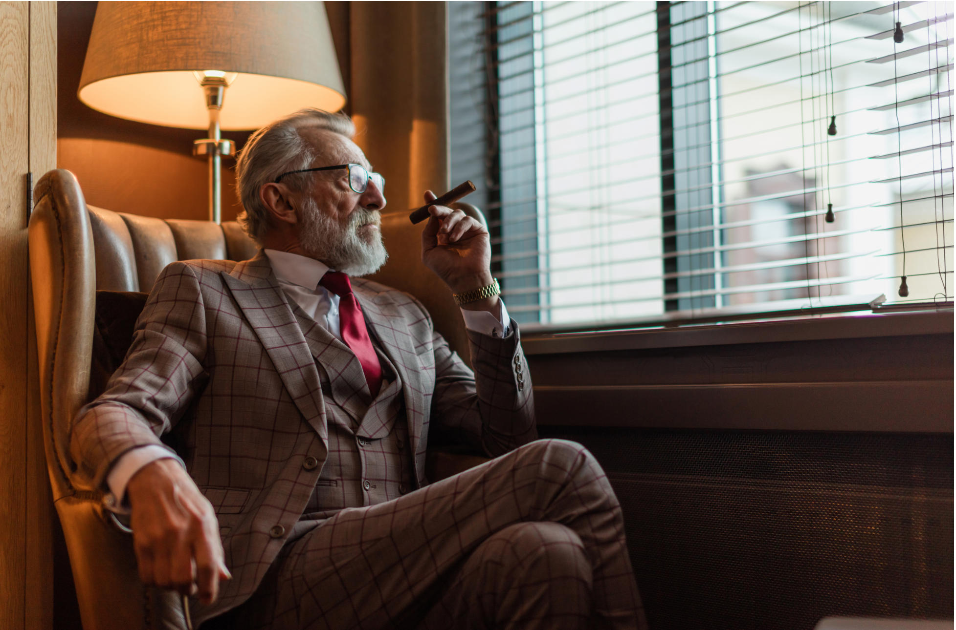 A Wealthy man sitting with a cigar contemplating the strategies of the rich and wealthy
